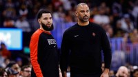 Houston Rockets guard Fred VanVleet (5) and head coach Ime Udoka look on in the second quarter against the Denver Nuggets at Ball Arena.