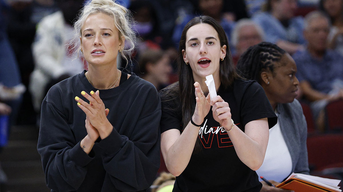 Injured Indiana Fever guard Sophie Cunningham (8) and guard Caitlin Clark (22) react from the bench during the first half of a WNBA game against the Chicago Sky at United Center.