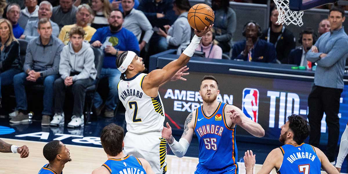 Indiana Pacers guard Andrew Nembhard (2) shoots the ball while Oklahoma City Thunder center Isaiah Hartenstein (55) defends in the first half at Gainbridge Fieldhouse.