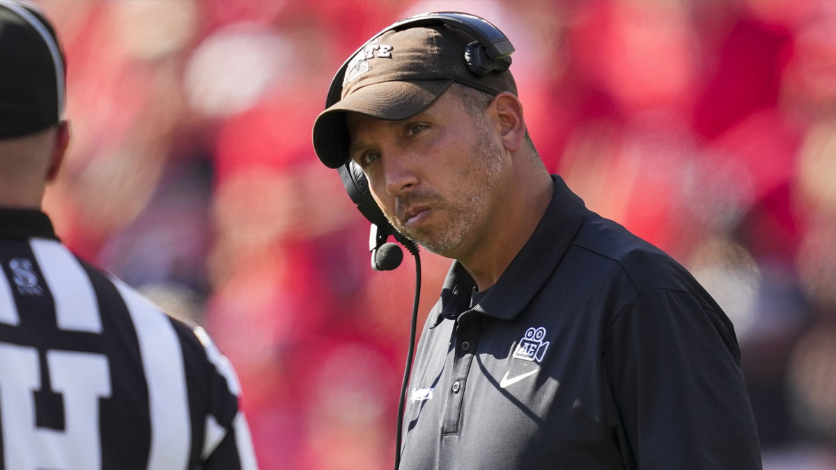 Iowa State Cyclones head coach Matt Campbell talks with an official during the game against the Cincinnati Bearcats in the second half at Nippert Stadium.