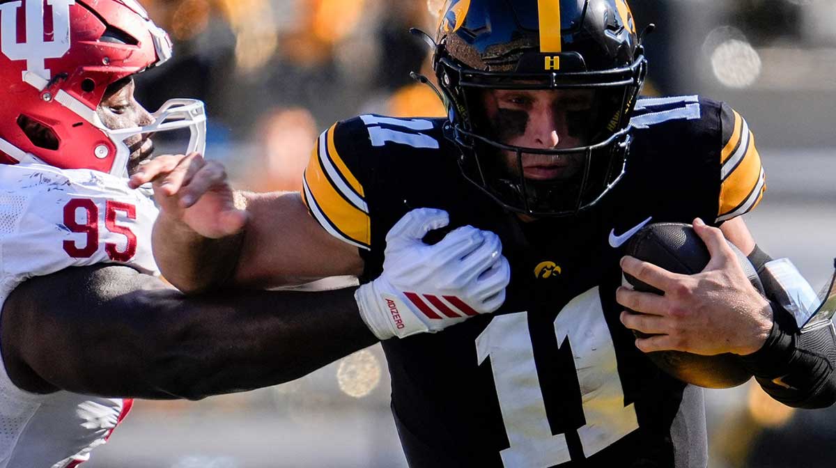 Iowa Hawkeyes quarterback Mark Gronowski (11) runs the ball against the Indiana Hoosiers Sept. 27, 2025 at Kinnick Stadium in Iowa City, Iowa.