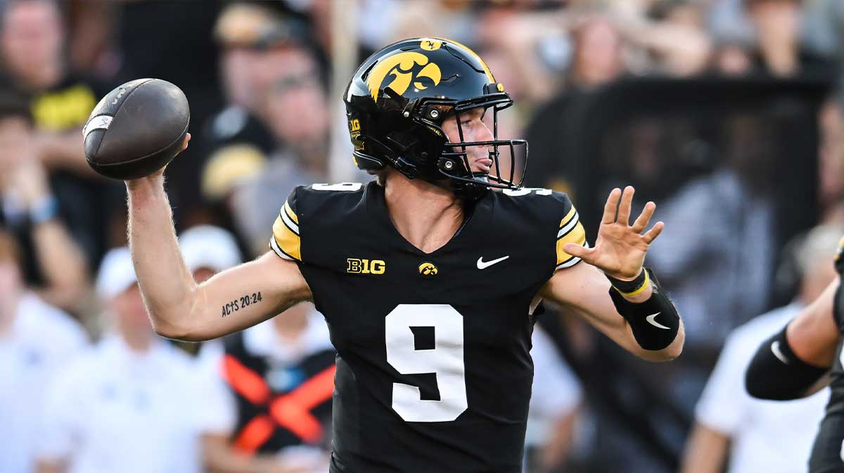 Iowa Hawkeyes quarterback Hank Brown (9) throws a pass against the Indiana Hoosiers during the fourth quarter at Kinnick Stadium.