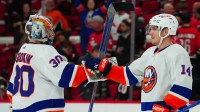 New York Islanders center Bo Horvat (14) and New York Islanders goaltender Ilya Sorokin (30) celebrate their victory against the Carolina Hurricanes at PNC Arena.