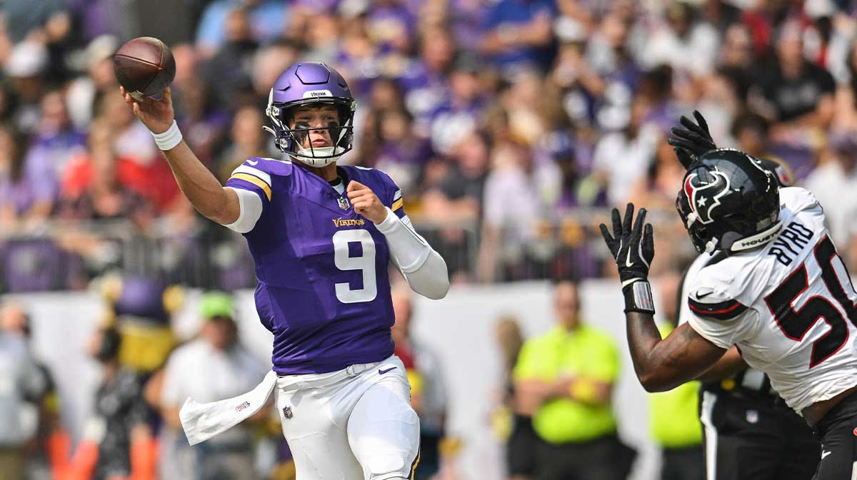 Minnesota Vikings quarterback J.J. McCarthy (9) throws a pass as Houston Texans defensive end Solomon Byrd (50) pursues during the first quarter at U.S. Bank Stadium.