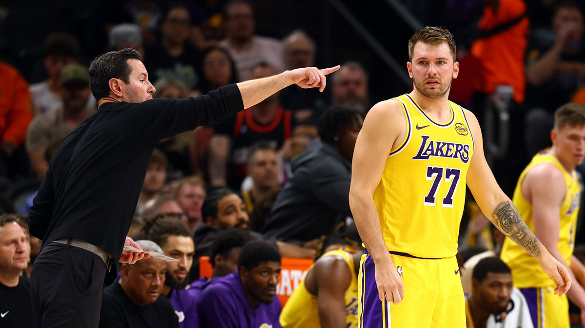 Los Angeles Lakers guard Luka Doncic (77) with head coach JJ Redick against the Phoenix Suns during an NBA preseason game at Mortgage Matchup Center.