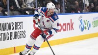 New York Rangers forward J.T. Miller (8) skates with the puck against the Toronto Maple Leafs in the first period at Scotiabank Arena