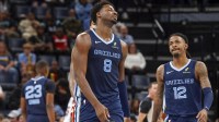 Memphis Grizzlies forward/center Jaren Jackson Jr. (8) and guard Ja Morant (12) react during the second quarter against the Miami Heat at FedExForum.