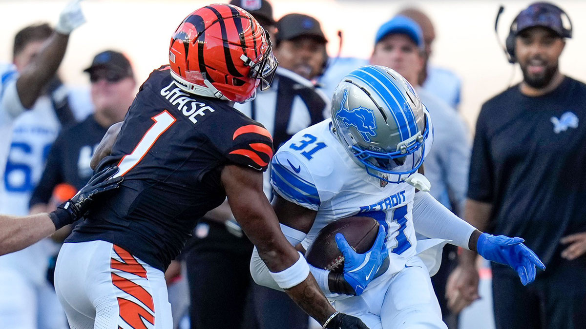 Detroit Lions safety Kerby Joseph (31) intercepts a pass intended for Cincinnati Bengals wide receiver Ja'Marr Chase (1) in the second quarter of the NFL Week 5 game between the Cincinnati Bengals and the Detroit Lions at Paycor Stadium in downtown Cincinnati on Sunday, Oct. 5, 2025.