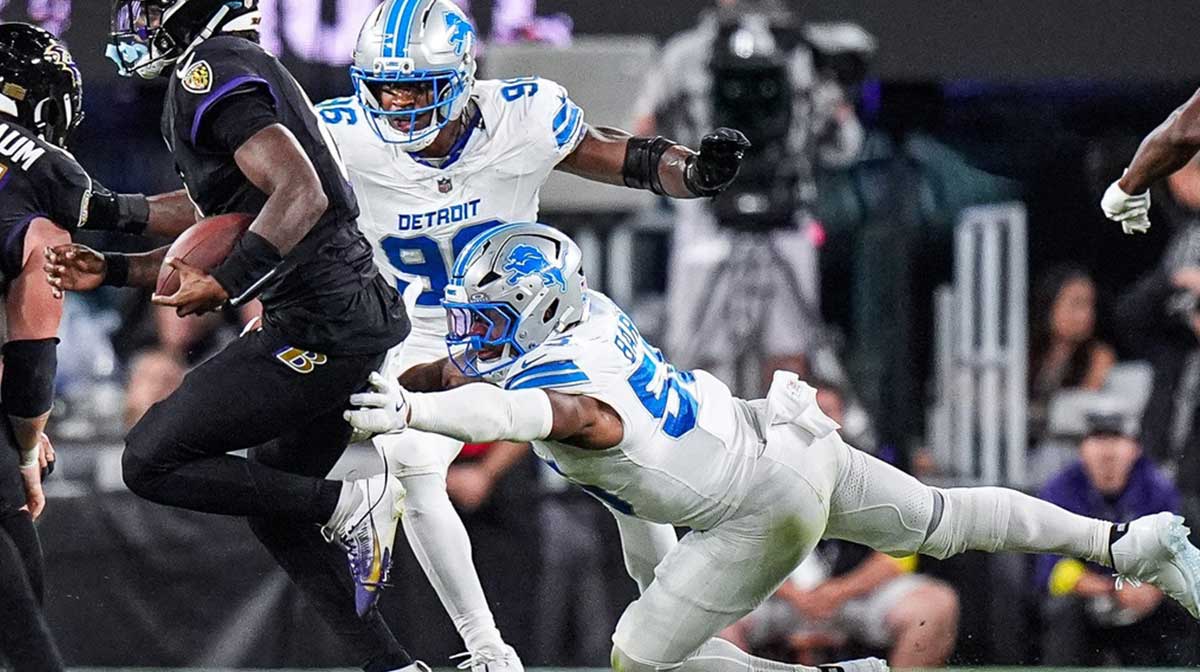 Detroit Lions linebacker Derrick Barnes (55) tackles Baltimore Ravens quarterback Lamar Jackson (8) during the second half at M&T Bank Stadium in Baltimore, Md. on Monday, Sept. 22, 2025.
