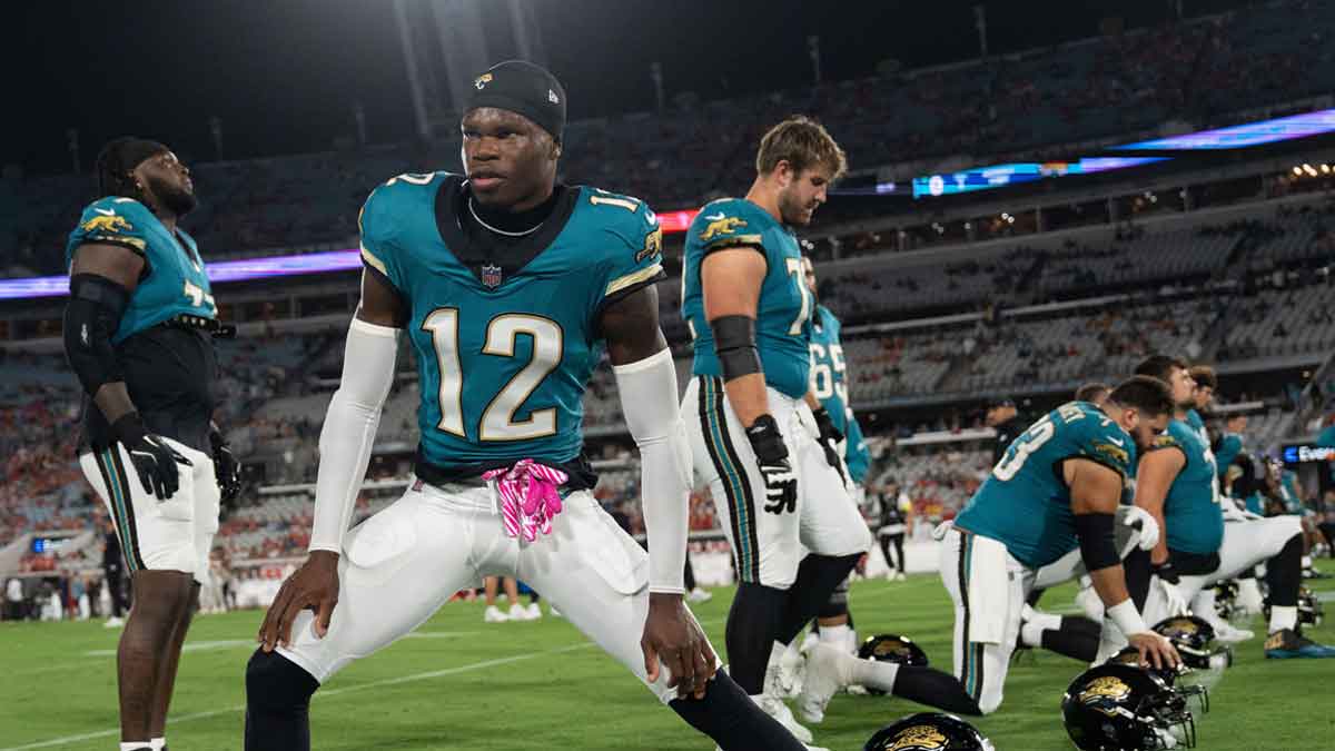 Jacksonville Jaguars wide receiver Travis Hunter (12) stretches before an Monday Night NFL football game
