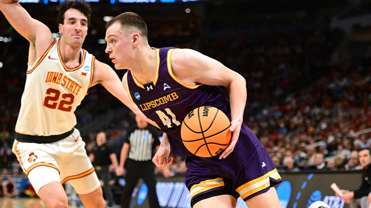 Lipscomb Bisons forward Jacob Ognacevic (41) drives against Iowa State Cyclones forward Milan Momcilovic (22) during the second half of a first round NCAA men’s tournament game at Fiserv Forum.