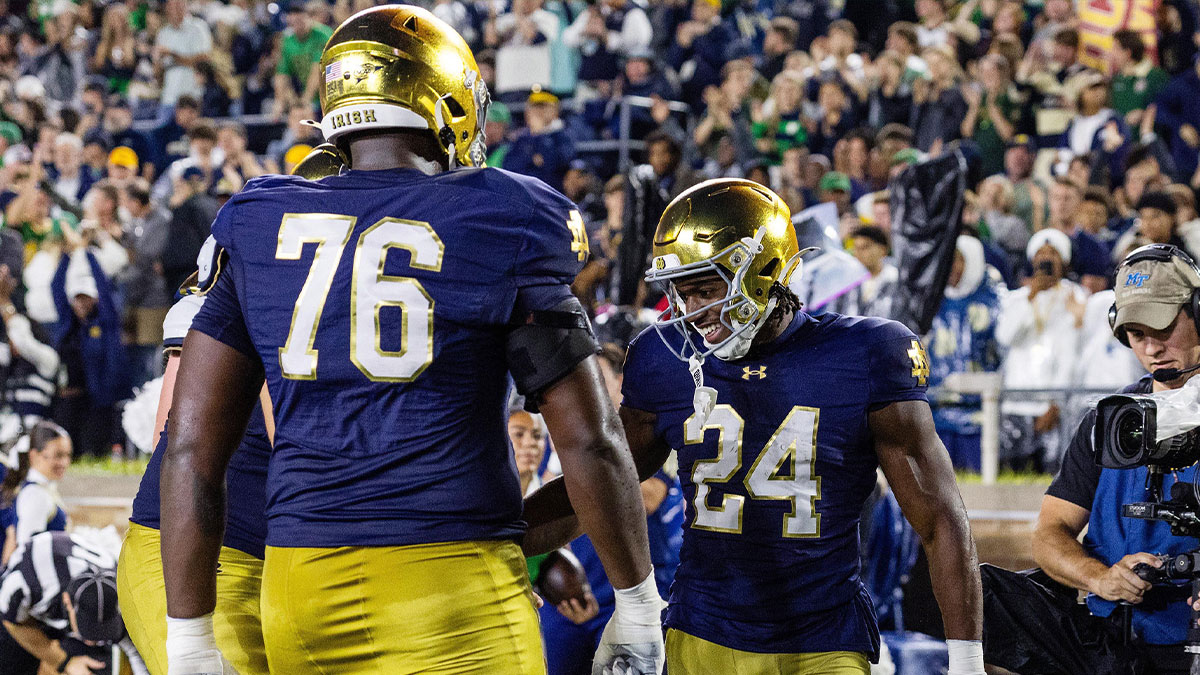 Notre Dame Fighting Irish running back Jadarian Price (24) celebrates his touchdown in the first half against the Southern California Trojans at Notre Dame Stadium.