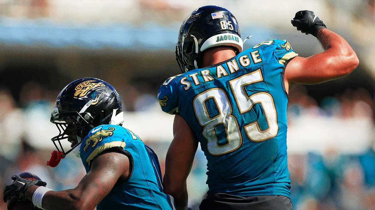 Jacksonville Jaguars running back Travis Etienne (1) celebrates his touchdown with teammate tight end Brenton Strange (85) during the fourth quarter of an NFL football matchup at EverBank Stadium,