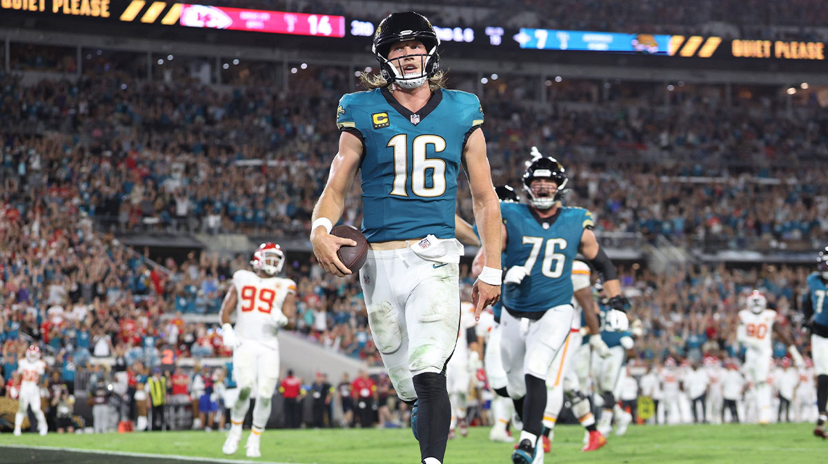 Jacksonville Jaguars quarterback Trevor Lawrence (16) scores a touchdown during the second half against the Kansas City Chiefs at EverBank Stadium.