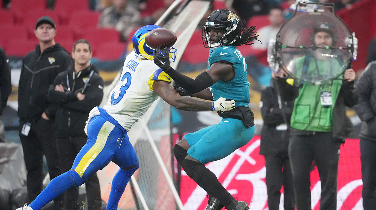 Los Angeles Rams safety Kam Curl (3) breaks up a pass intended for Jacksonville Jaguars wide receiver Brian Thomas Jr. (7) during the second half of an NFL International Series game at Wembley Stadium.