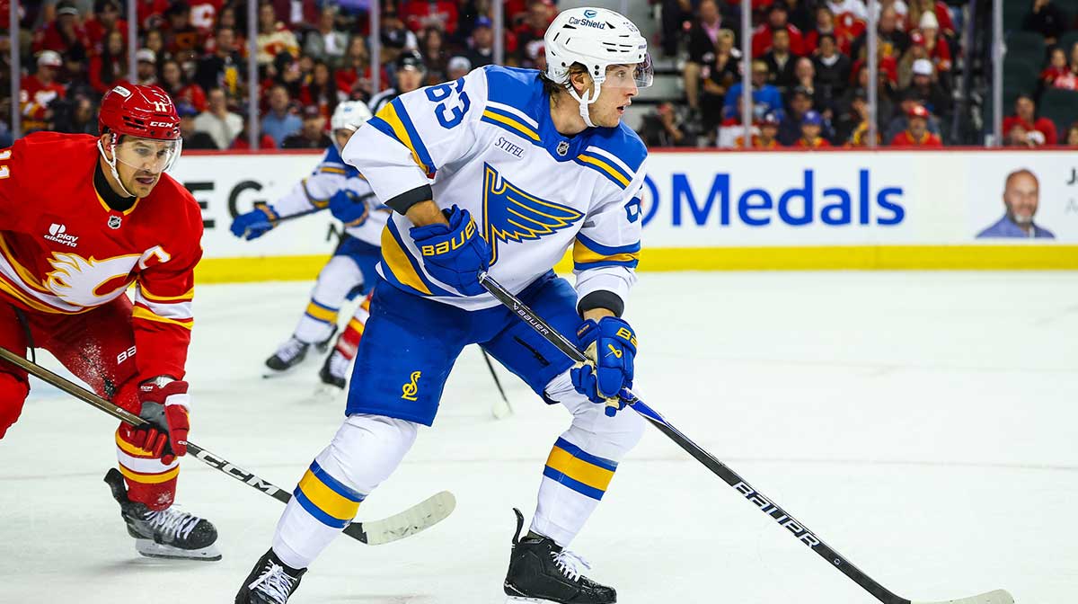 St. Louis Blues left wing Jake Neighbours (63) controls the puck against the Calgary Flames during the third period at Scotiabank Saddledome.