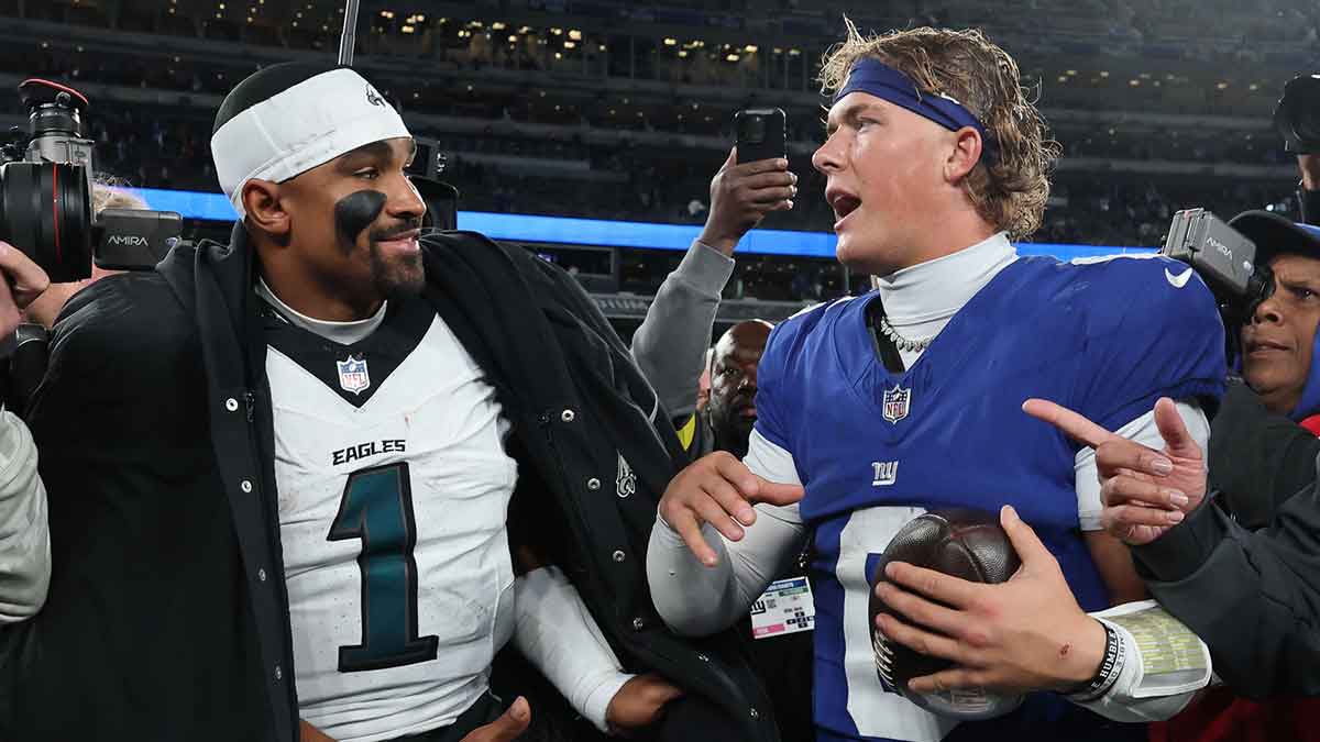 Philadelphia Eagles quarterback Jalen Hurts (1) and New York Giants quarterback Jaxson Dart (6) shake hands after the game at MetLife Stadium.