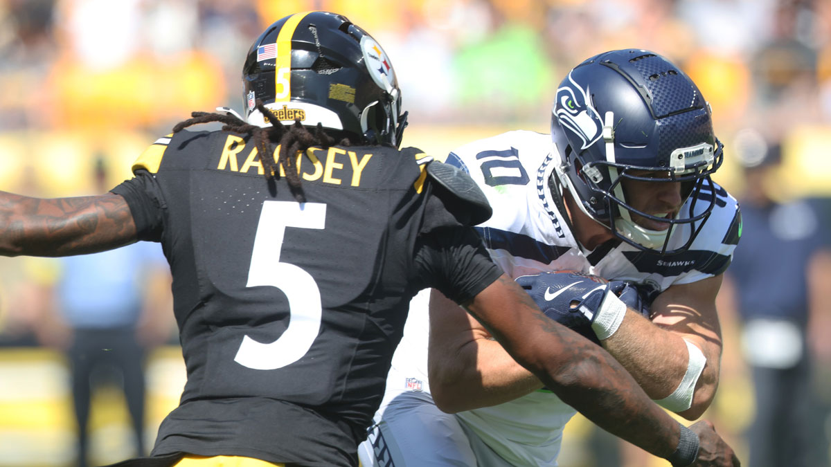 Seattle Seahawks wide receiver Cooper Kupp (10) runs after a catch as Pittsburgh Steelers cornerback Jalen Ramsey (5) defends during the third quarter at Acrisure Stadium.