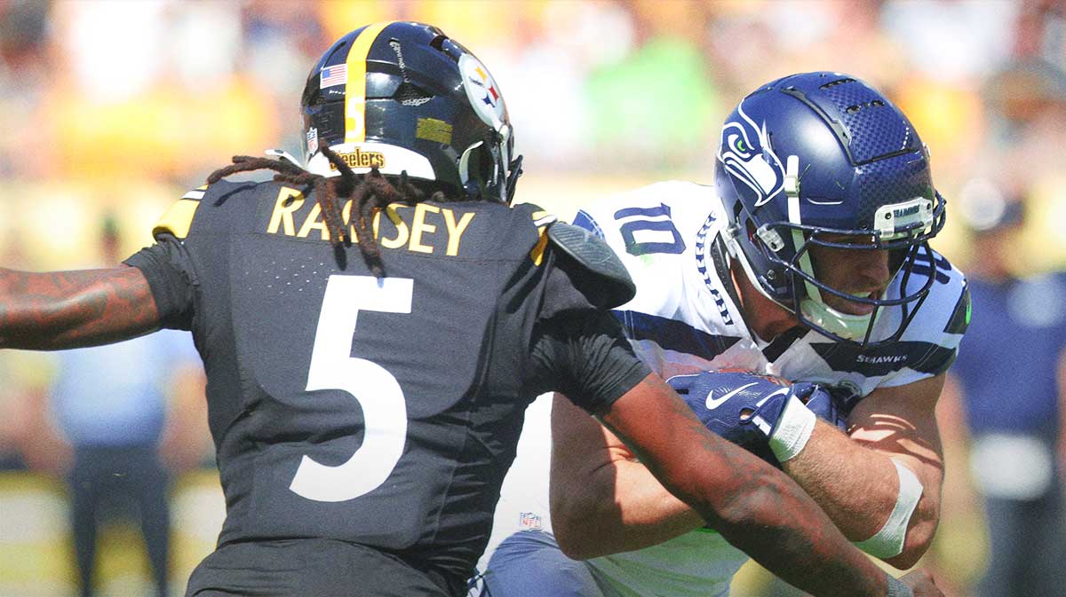Seattle Seahawks wide receiver Cooper Kupp (10) runs after a catch as Pittsburgh Steelers cornerback Jalen Ramsey (5) defends during the third quarter at Acrisure Stadium.