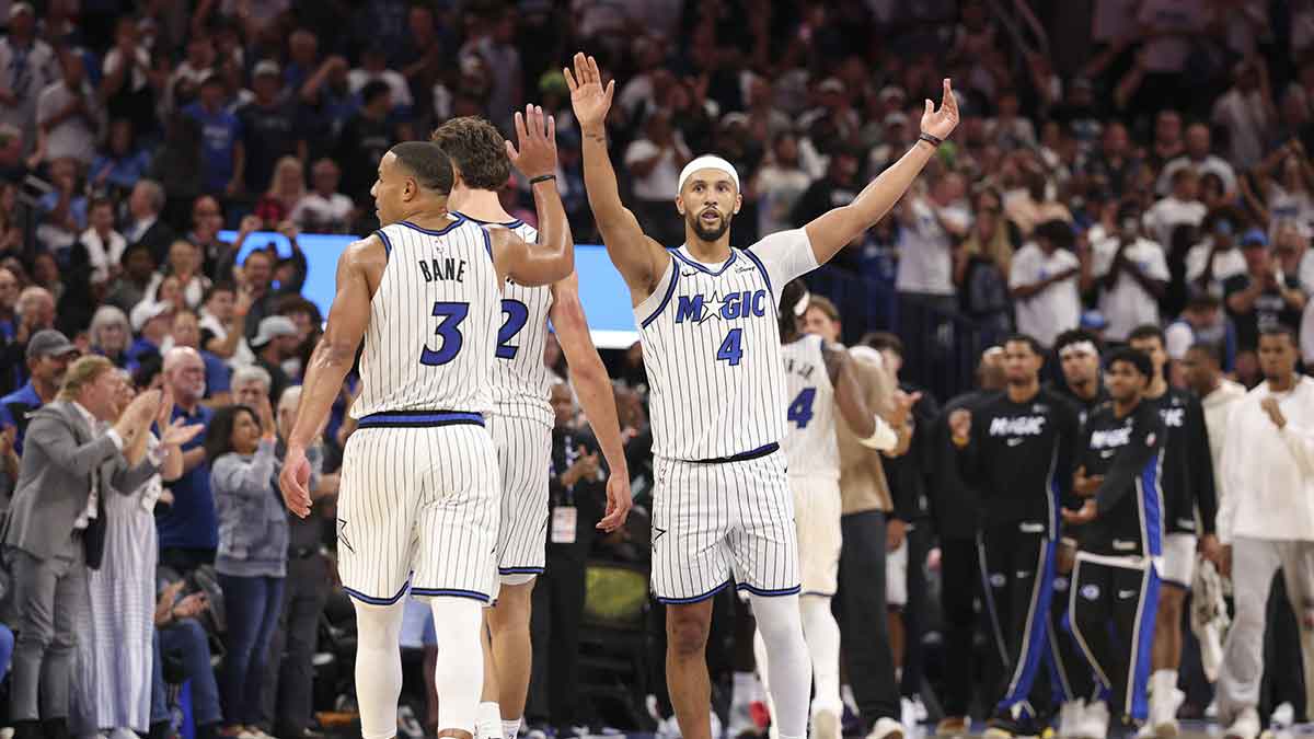 Orlando Magic guard Jalen Suggs (4) reacts with guard Desmond Bane (3) after a play against the Miami Heat in the fourth quarter at Kia Center.