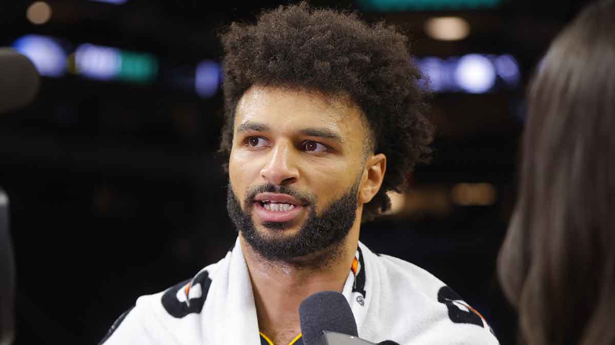 Nuggets guard Jamal Murray (27)answers questions during an interview.