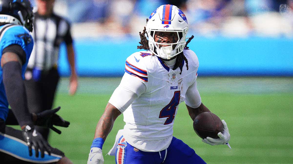 Buffalo Bills running back James Cook III (4) runs against Carolina Panthers cornerback Jaycee Horn (8) during the first half at Bank of America Stadium.