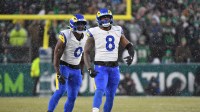 Los Angeles Rams linebacker Byron Young (0) and linebacker Jared Verse (8) celebrate a sack against the Philadelphia Eagles.