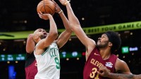 Boston Celtics guard Derrick White (9) shoots against Cleveland Cavaliers center Jarrett Allen (31) in the first quarter at TD Garden.