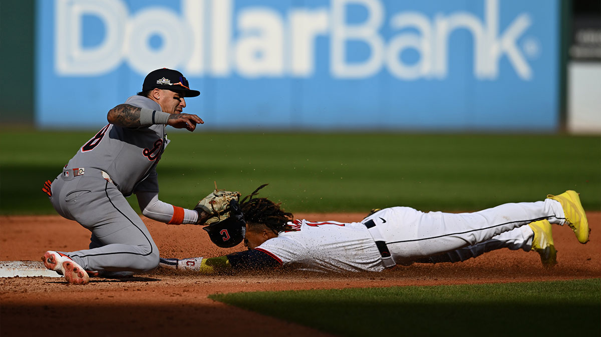 Detroit Tigers outfielder Javier Baez (28) tags out Cleveland Guardians third baseman Jose Ramirez (11) on an attempted steal in the fourth inning during game three of the Wildcard round for the 2025 MLB playoffs at Progressive Field.