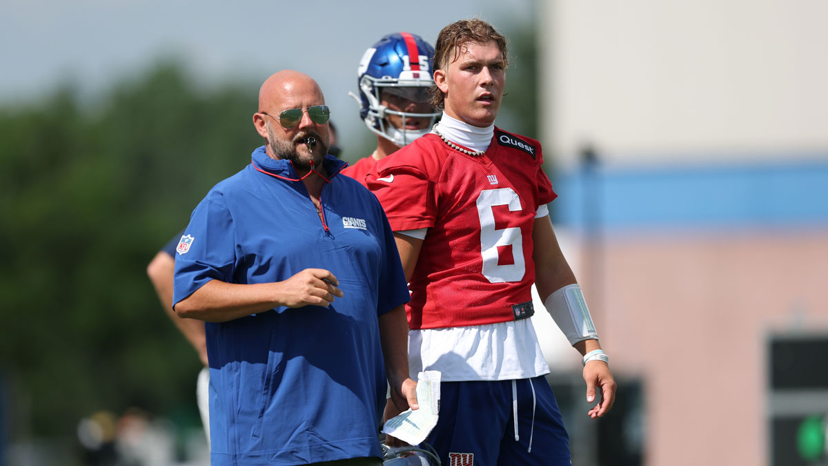 New York Giants head coach Brian Daboll and quarterback Jaxson Dart (6) during training camp at Quest Diagnostics Training Center.