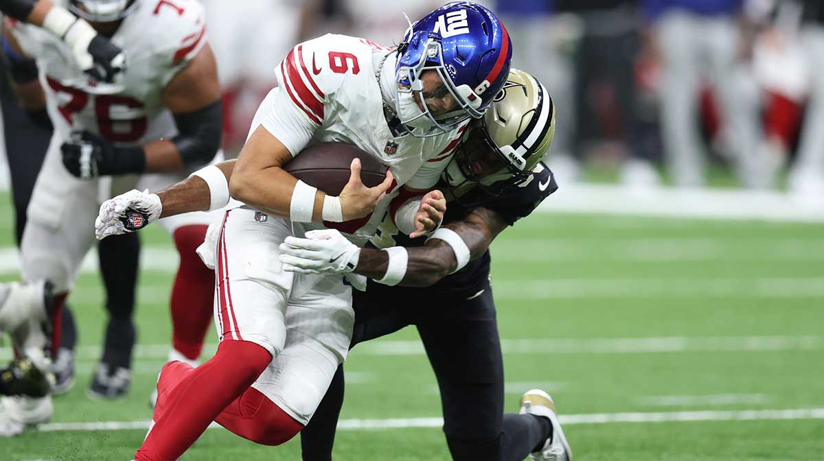 New York Giants quarterback Jaxson Dart (6) runs with the ball against the New Orleans Saints during the second half at Caesars Superdome.