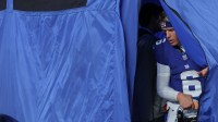 New York Giants quarterback Jaxson Dart (6) leaves the injury tent during the third quarter of the game against the Philadelphia Eagles at MetLife Stadium.