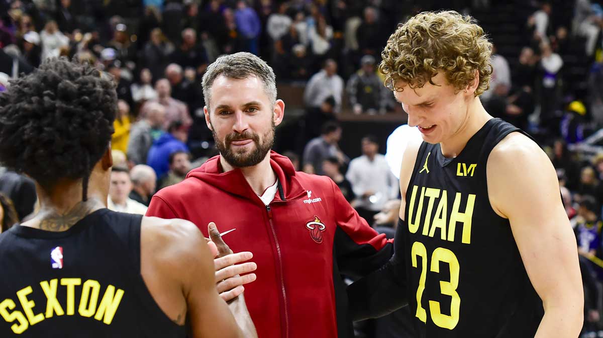 Miami Heat forward/center Kevin Love (42) congratulates Utah Jazz guard Collin Sexton (2) and forward/center Lauri Markkanen (23) after beating the Miami Heat at Vivint Arena.
