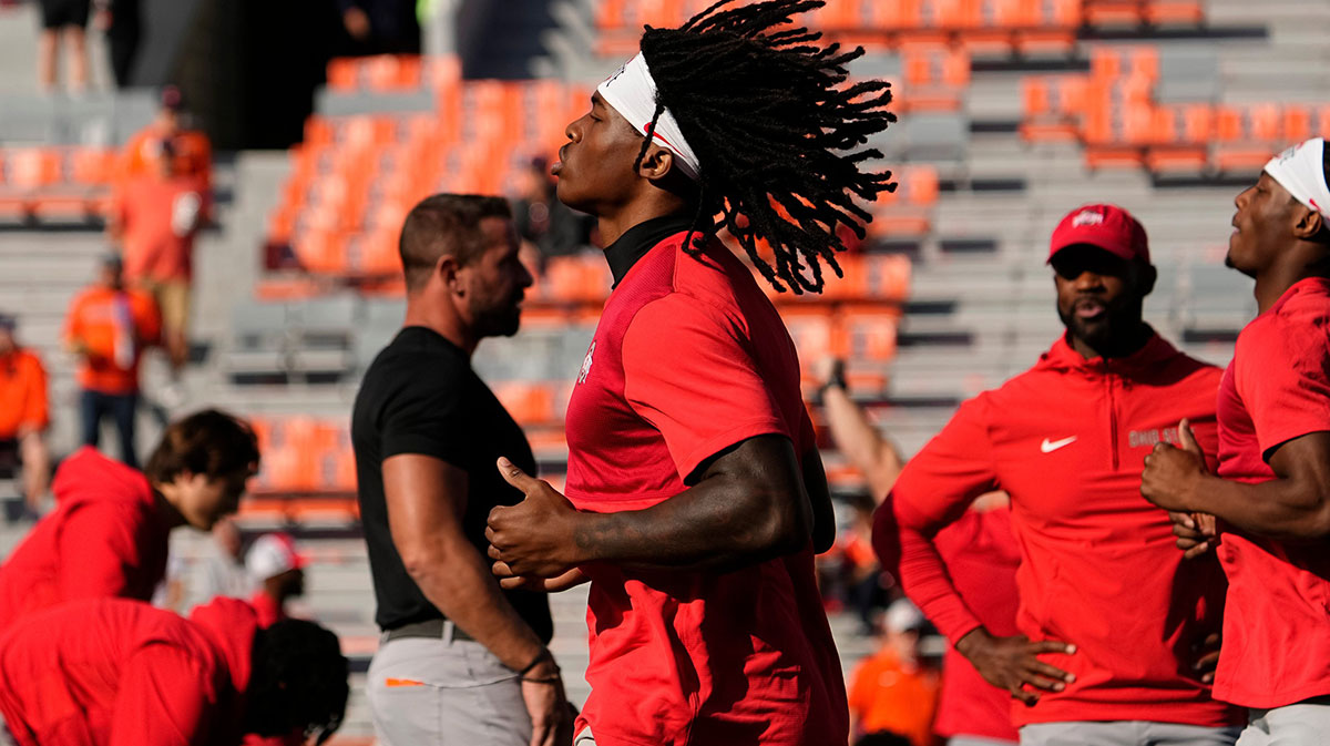 Ohio State Buckeyes wide receiver Jeremiah Smith (4) warms up prior to the NCAA football game against the Illinois Fighting Illini at Gies Memorial Stadium.