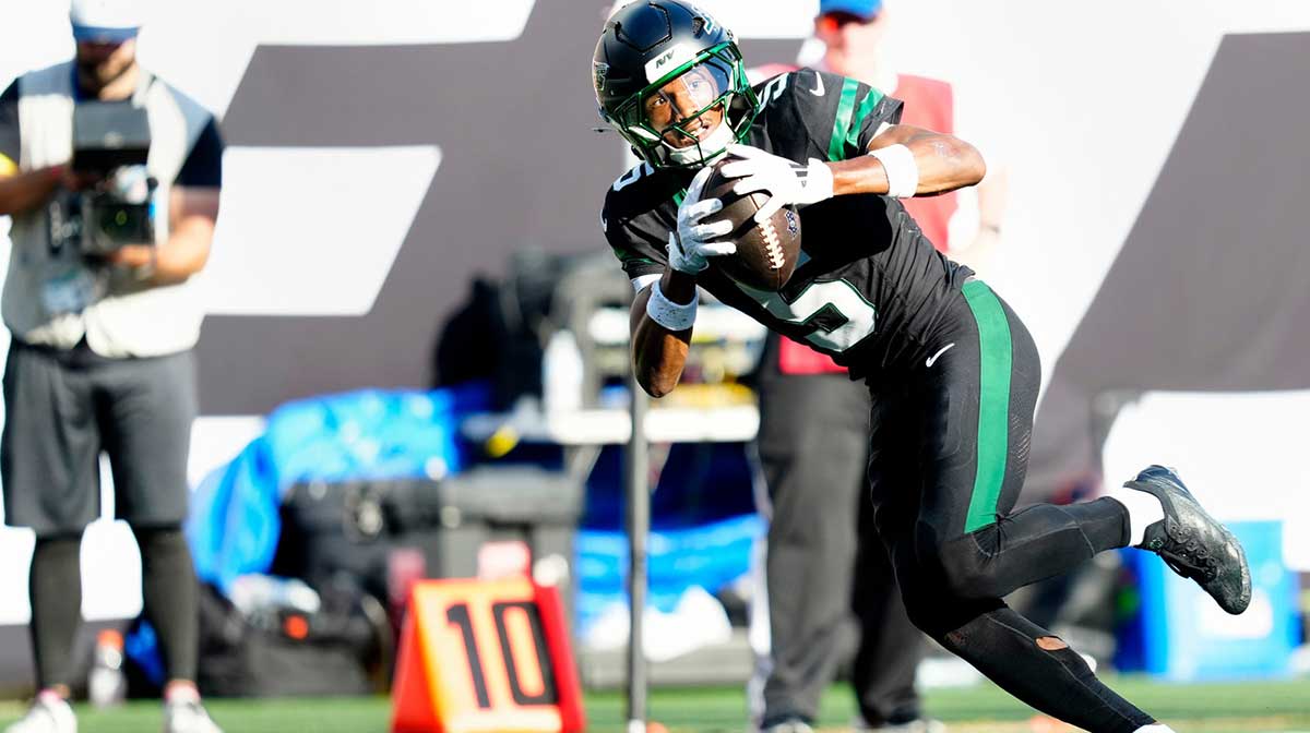 New York Jets wide receiver Garrett Wilson (5) completes a pass which he ran in for a touchdown, Sunday, October 5, 2025.