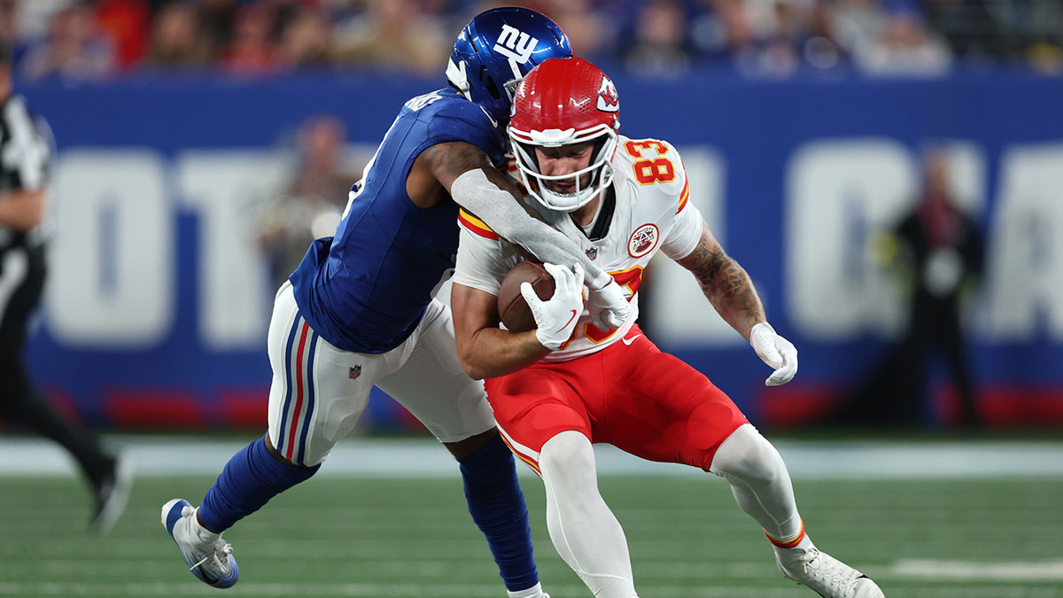 New York Giants safety Jevon Holland (8) tackles Kansas City Chiefs tight end Noah Gray (83) in the first quarter at MetLife Stadium.