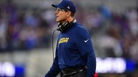 Los Angeles Chargers head coach Jim Harbaugh reacts during the first half at SoFi Stadium.