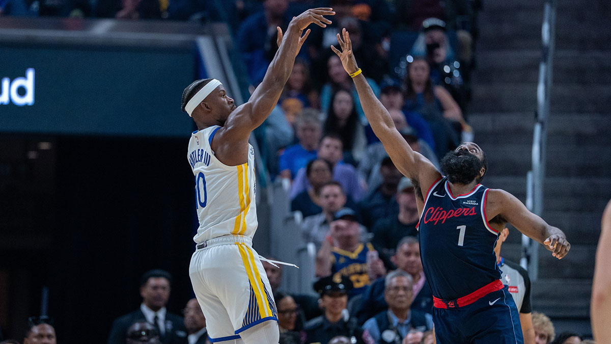 Golden State Warriors forward Jimmy Butler III (10) shoots a three point shot over LA Clippers guard James Harden (1) during the second quarter at Chase Center.