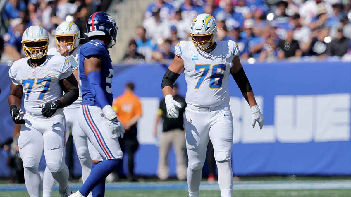 Los Angeles Chargers offensive tackle Joe Alt (76) walks to the line against New York Giants linebacker Abdul Carter (51) during the first quarter at MetLife Stadium.