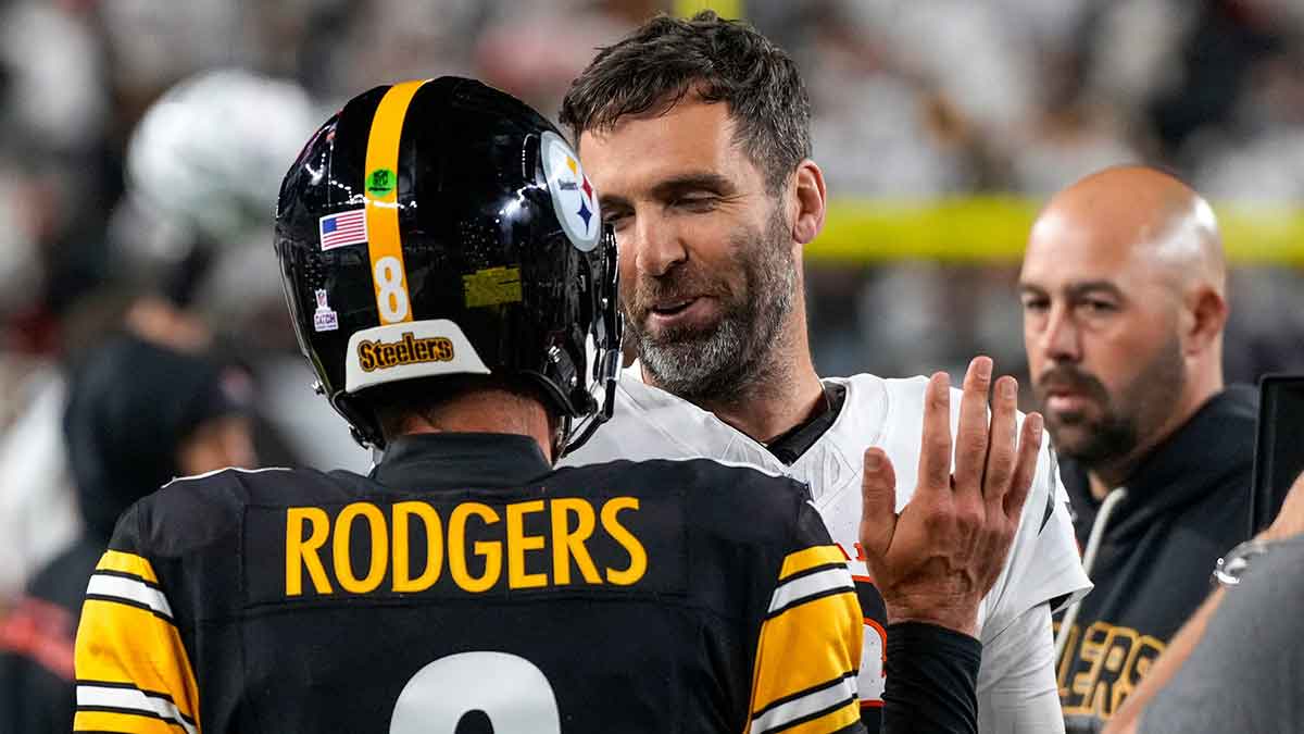 Pittsburgh Steelers quarterback Aaron Rodgers (8) and Cincinnati Bengals quarterback Joe Flacco (16) shake hands after the fourth quarter of the NFL Week 7 game between the Cincinnati Bengals and the Pittsburgh Steelers at Paycor Stadium in downtown Cincinnati on Thursday, Oct. 16, 2025. The Bengals won, 33-31.