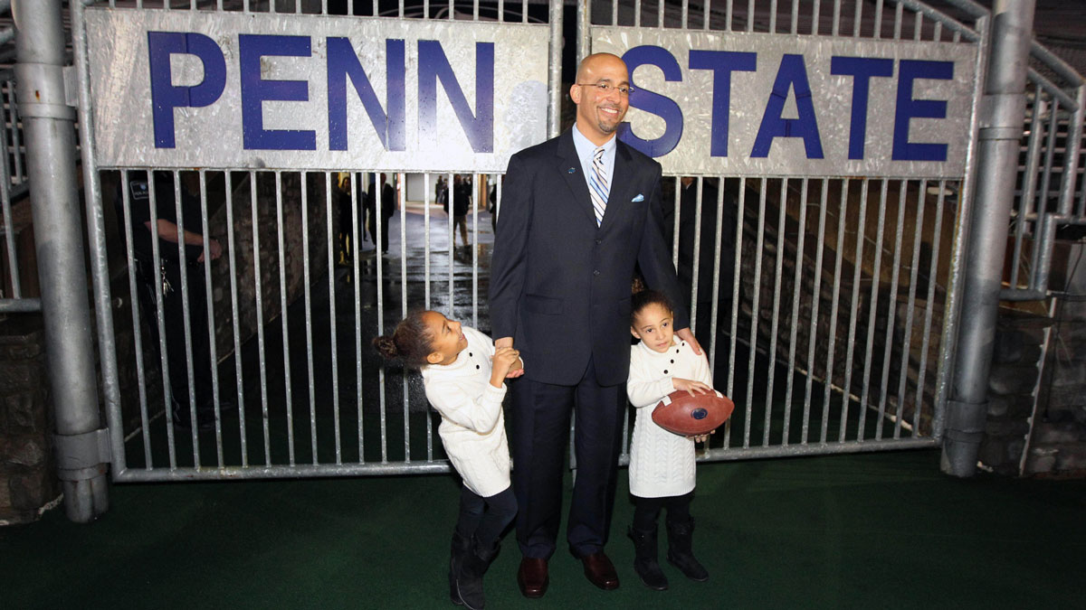 New Penn State head coach James Franklin walks onto the field with daughters Shola Franklin (left) and Addison Franklin (right) after James Franklin is announced as the Penn State Nittany Lions new head coach during a press conference at Beaver Stadium.