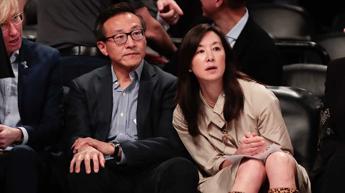Taiwanese businessman Joe Tsai (left) looks on during the second half of the preseason WNBA game between the New York Liberty and the China National Team at Barclays Center.