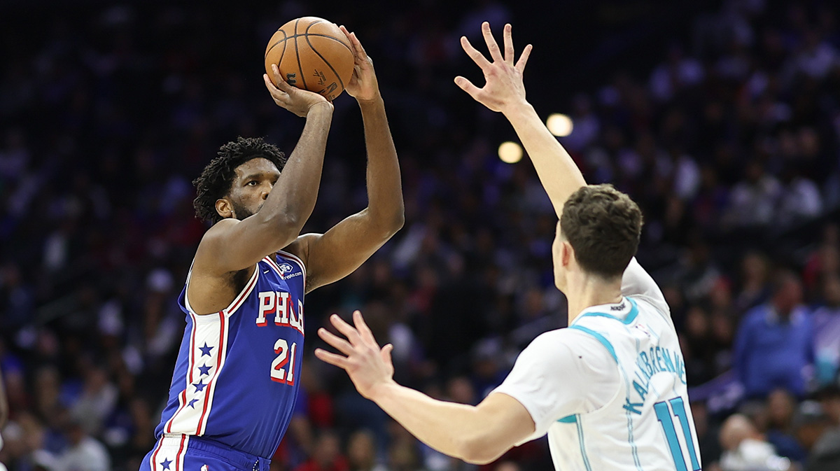Philadelphia 76ers center Joel Embiid (21) shoots past Charlotte Hornets center Ryan Kalkbrenner (11) during the first quarter at Xfinity Mobile Arena.