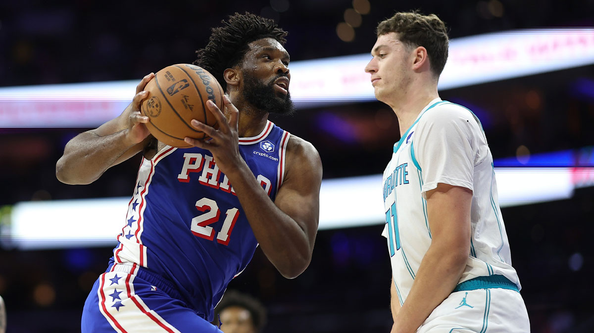 Philadelphia 76ers center Joel Embiid (21) drives against Charlotte Hornets center Ryan Kalkbrenner (11) during the first quarter at Xfinity Mobile Arena.