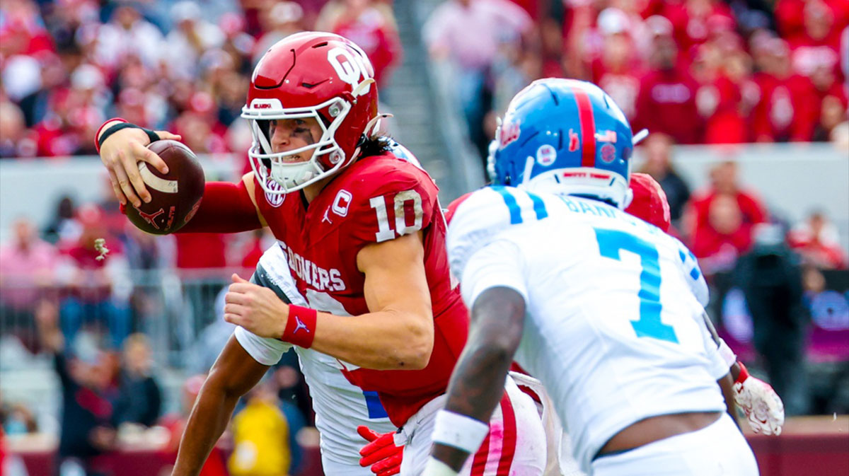 Ole Miss Rebels safety TJ Banks (7) chases Oklahoma Sooners quarterback John Mateer (10) during the second half at Gaylord Family-Oklahoma Memorial Stadium.