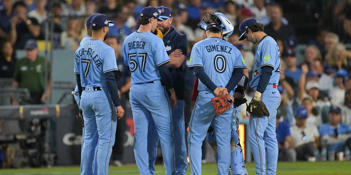 Toronto Blue Jays manager John Schneider (14) pulls Toronto Blue Jays pitcher Shane Bieber (57) from the game during the sixth inning against the Los Angeles Dodgers during game four of the 2025 MLB World Series at Dodger Stadium.