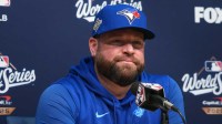 Toronto Blue Jays manager John Schneider (14) speaks in a press conference before game three of the 2025 MLB World Series against the Los Angeles Dodgers at Dodger Stadium.