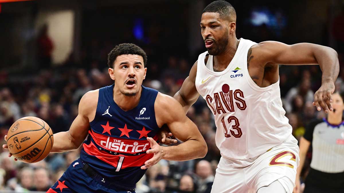 Washington Wizards guard Johnny Davis (1) drives to the basket against Cleveland Cavaliers center Tristan Thompson (13) during the first half at Rocket Mortgage FieldHouse.