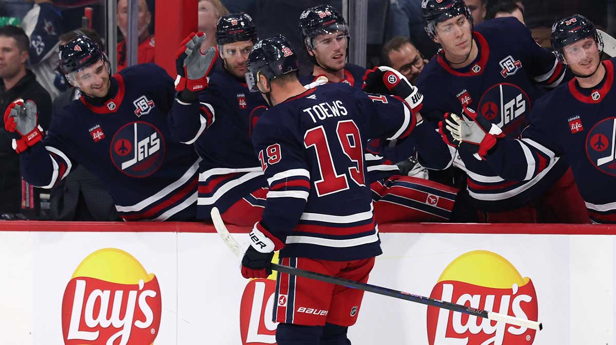 Winnipeg Jets center Jonathan Toews (19) celebrates a goal against the Calgary Flames in the second period at Canada Life Centre.