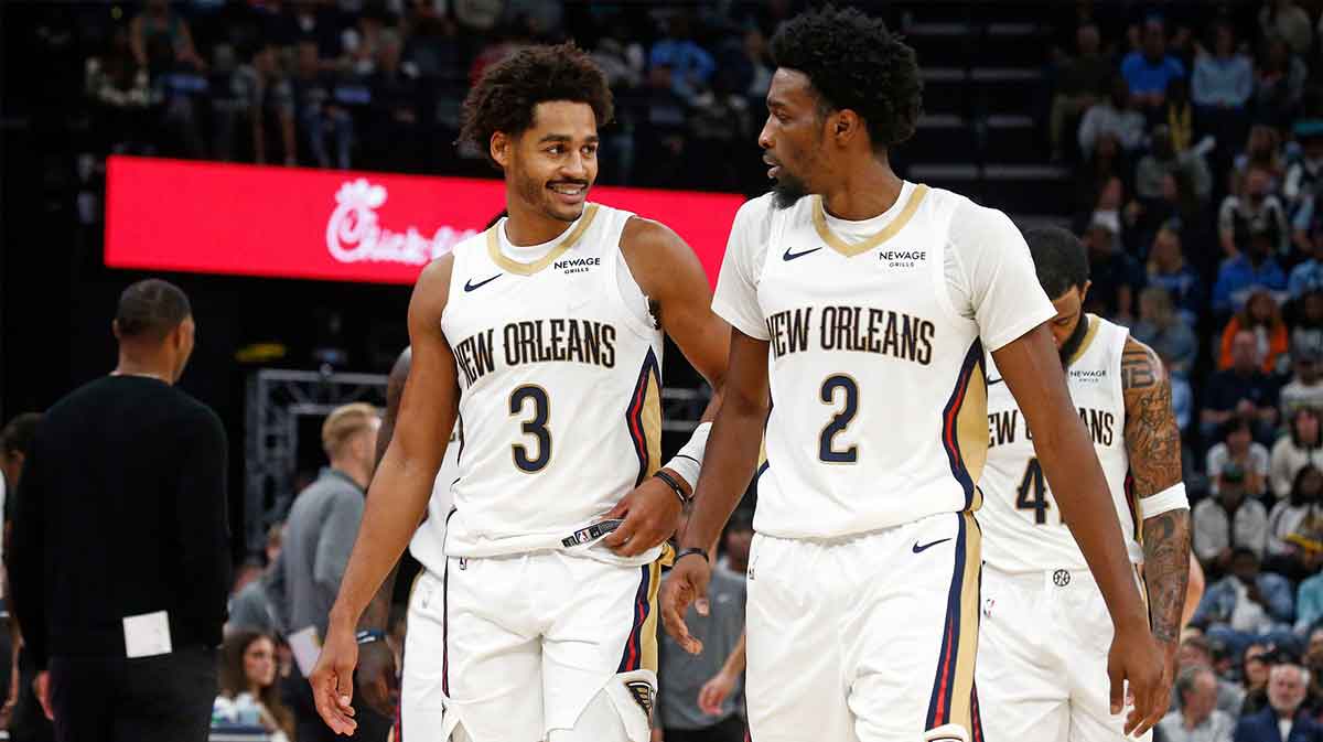 Oct 22, 2025; Memphis, Tennessee, USA; New Orleans Pelicans guard Jordan Poole (3) and forward Herbert Jones (2) react during the second quarter against the Memphis Grizzlies at FedExForum. Mandatory Credit: Petre Thomas-Imagn Images